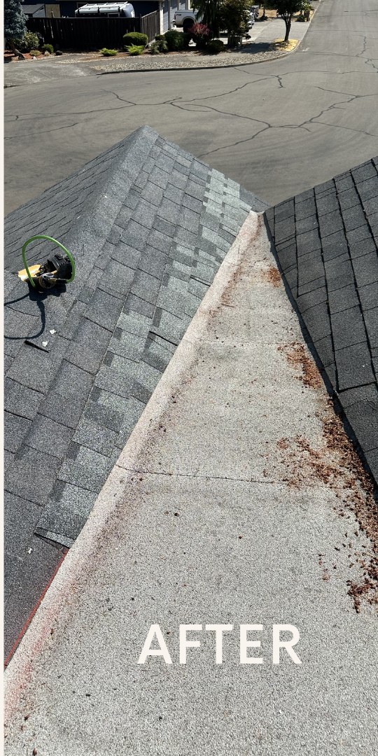 Roof ridge and valley after shingle repair with debris cleared