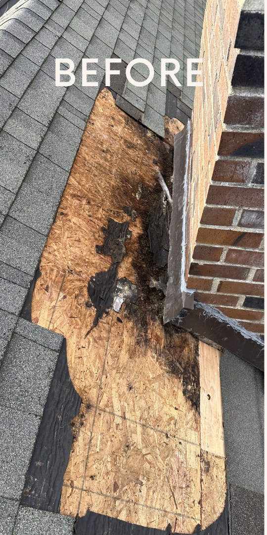 Rotted roof decking exposed around a brick chimney before flashing repair